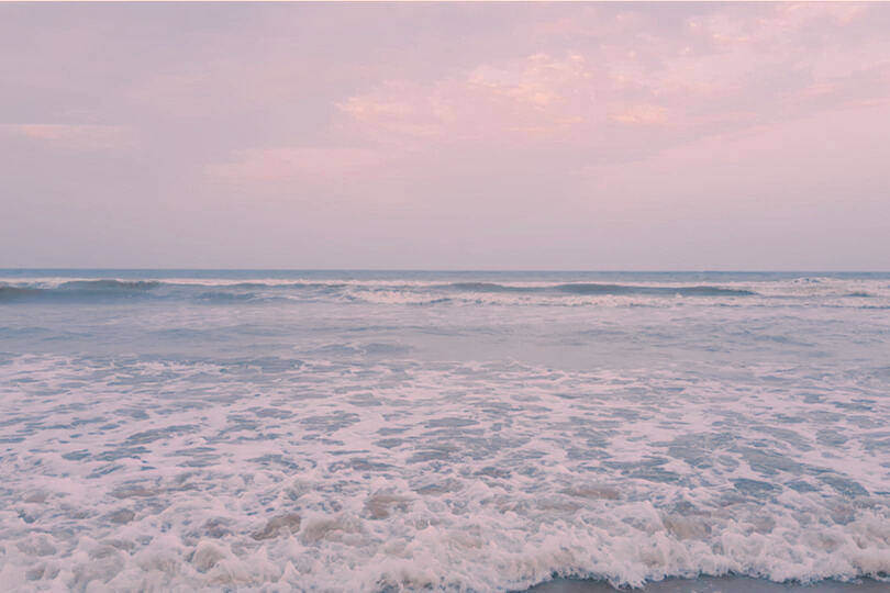 image with beautiful sunset and it consists of water,Ocean waves and sunset